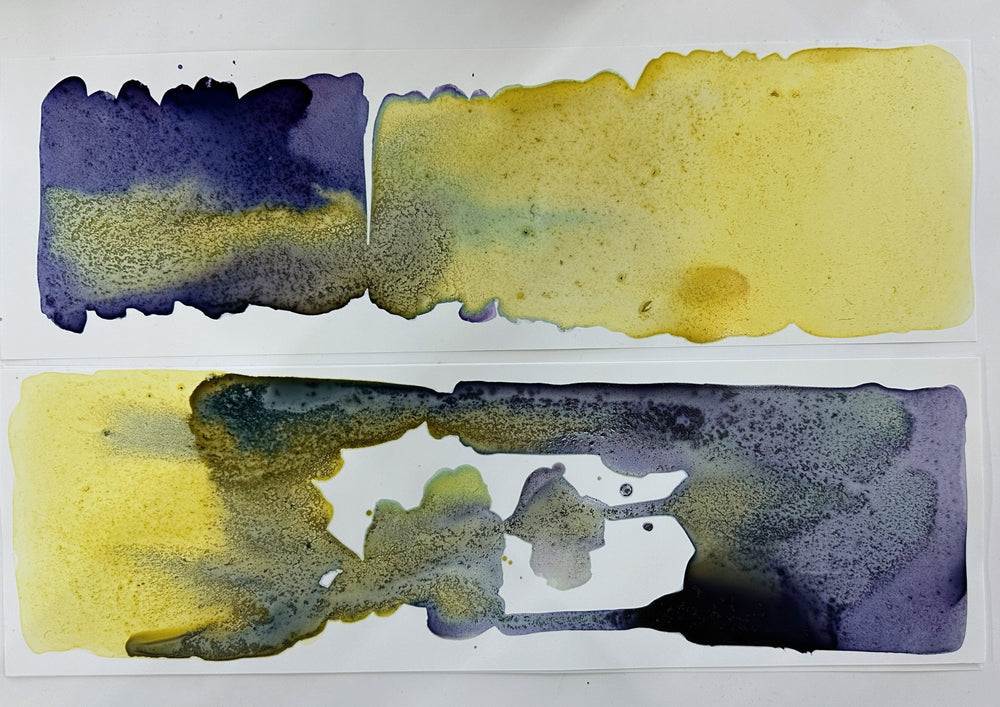 Two colour stripes in yellow and violet, made from home made plant colours, on a sheet.