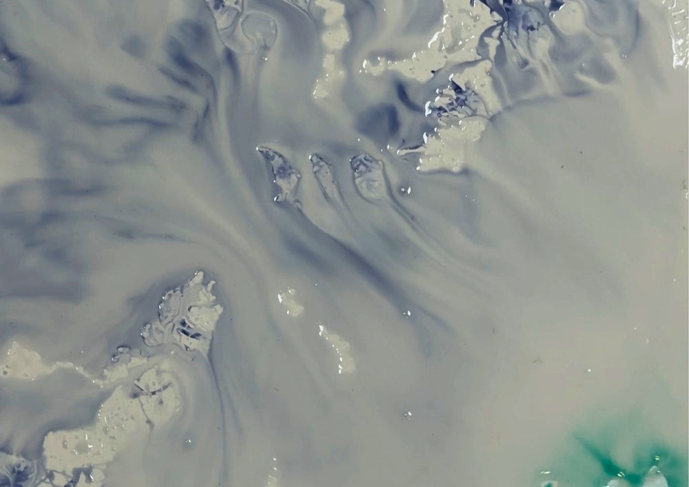 Close-up of colour dissolving from the smooth surface in water.